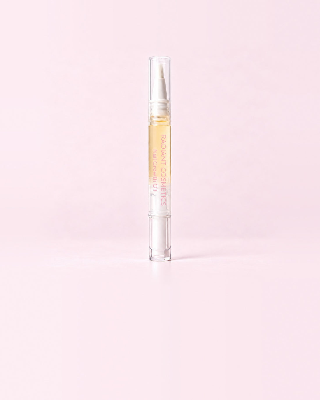 Radiant Cosmetics nail growth oil pen with a drop of oil