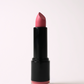 ‘Eye Candy’ soft matte lipstick, a vibrant pink, standing open in a black tube on a light pink background