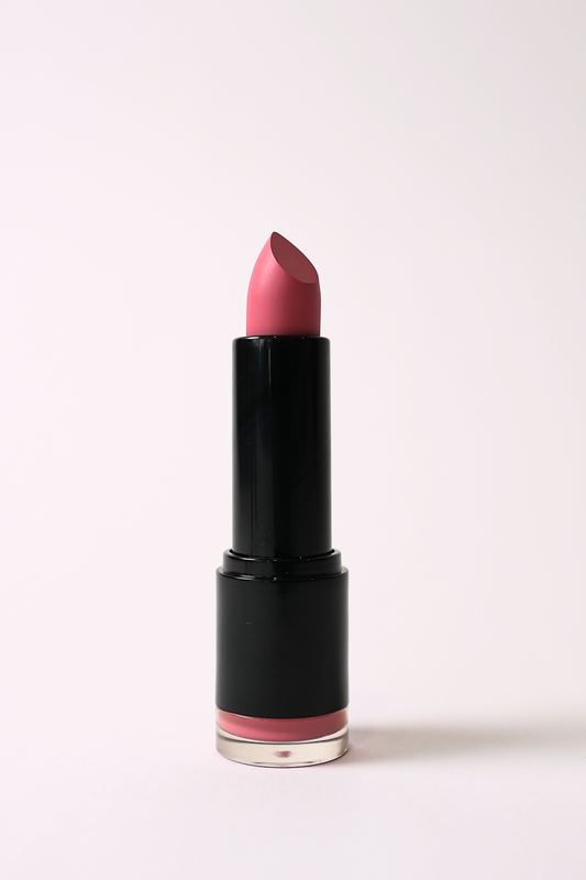 ‘Eye Candy’ soft matte lipstick, a vibrant pink, standing open in a black tube on a light pink background